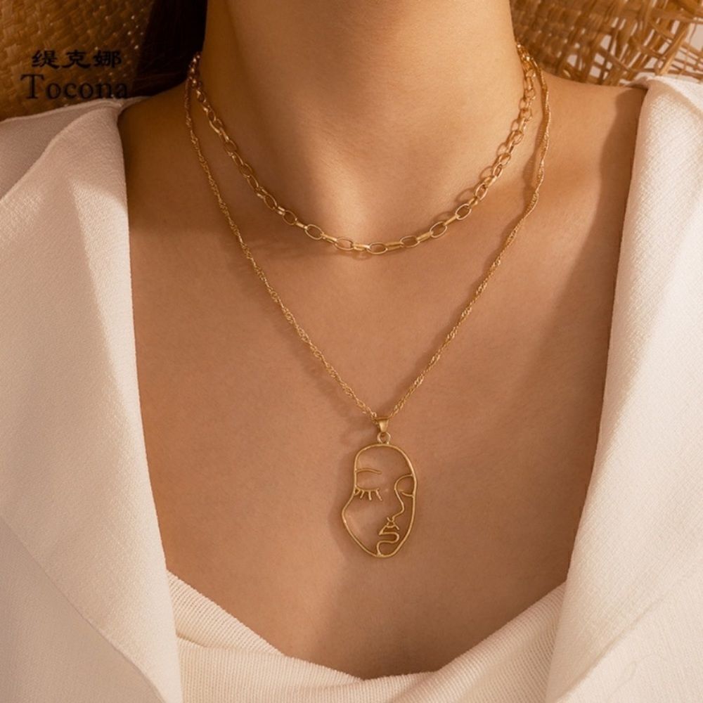 Fashion Jewelry NWT Double Layered Abstract Face Necklace